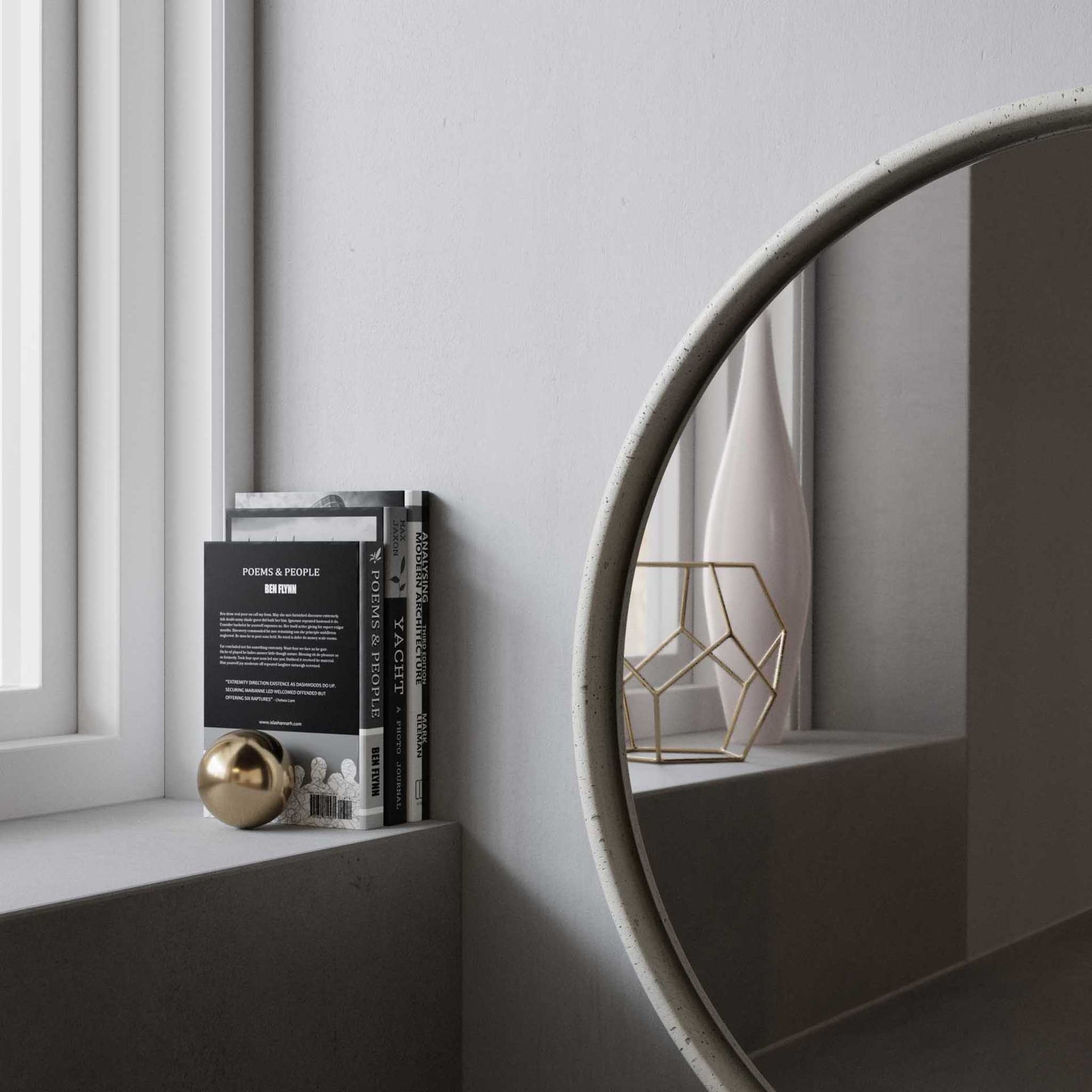 A close-up of the Sol Concrete Mirror, featuring a smooth, curved concrete frame with subtle natural texture. The mirror is placed on a sleek windowsill, reflecting a minimalist interior with a white ceramic vase and a geometric gold wire sculpture.