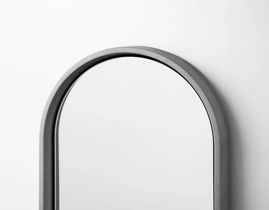 The top of an arc in the Lunar Concrete Mirror in the colour Koala Grey.