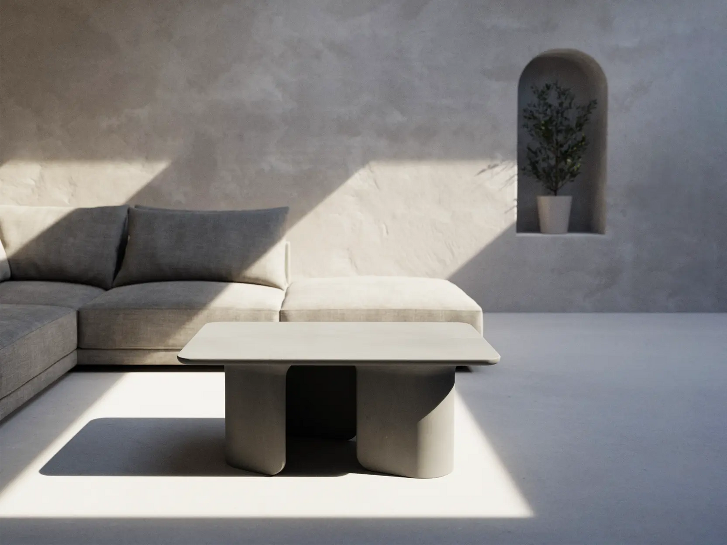 A Mist Grey Tor Concrete Coffee table in an open minimalist living space.