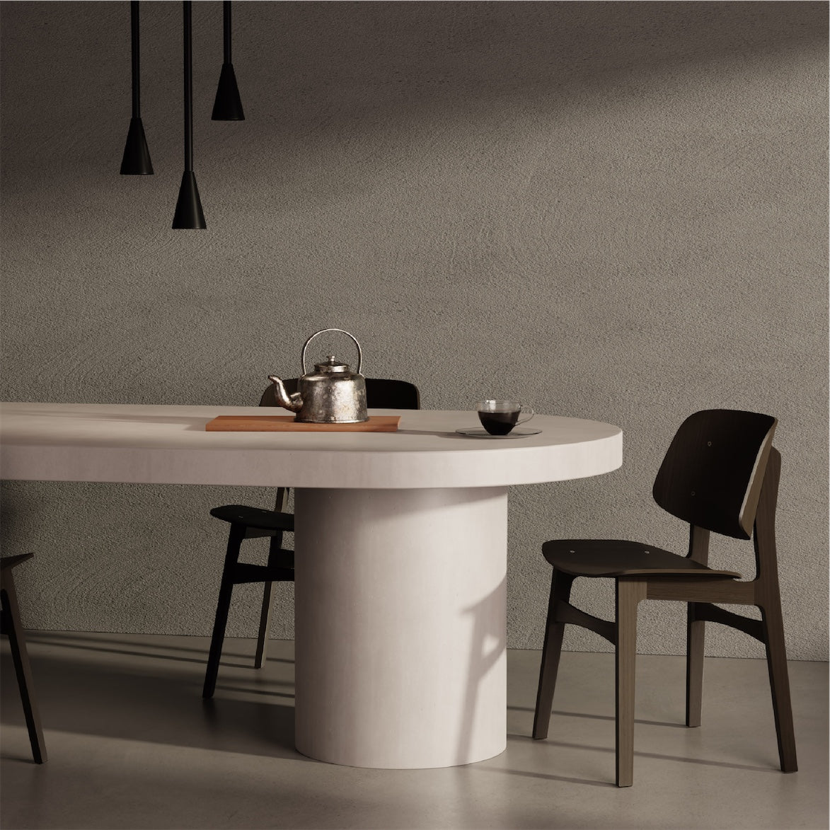 A Verona Concrete Dining Table sitting in front of a rendered wall. 