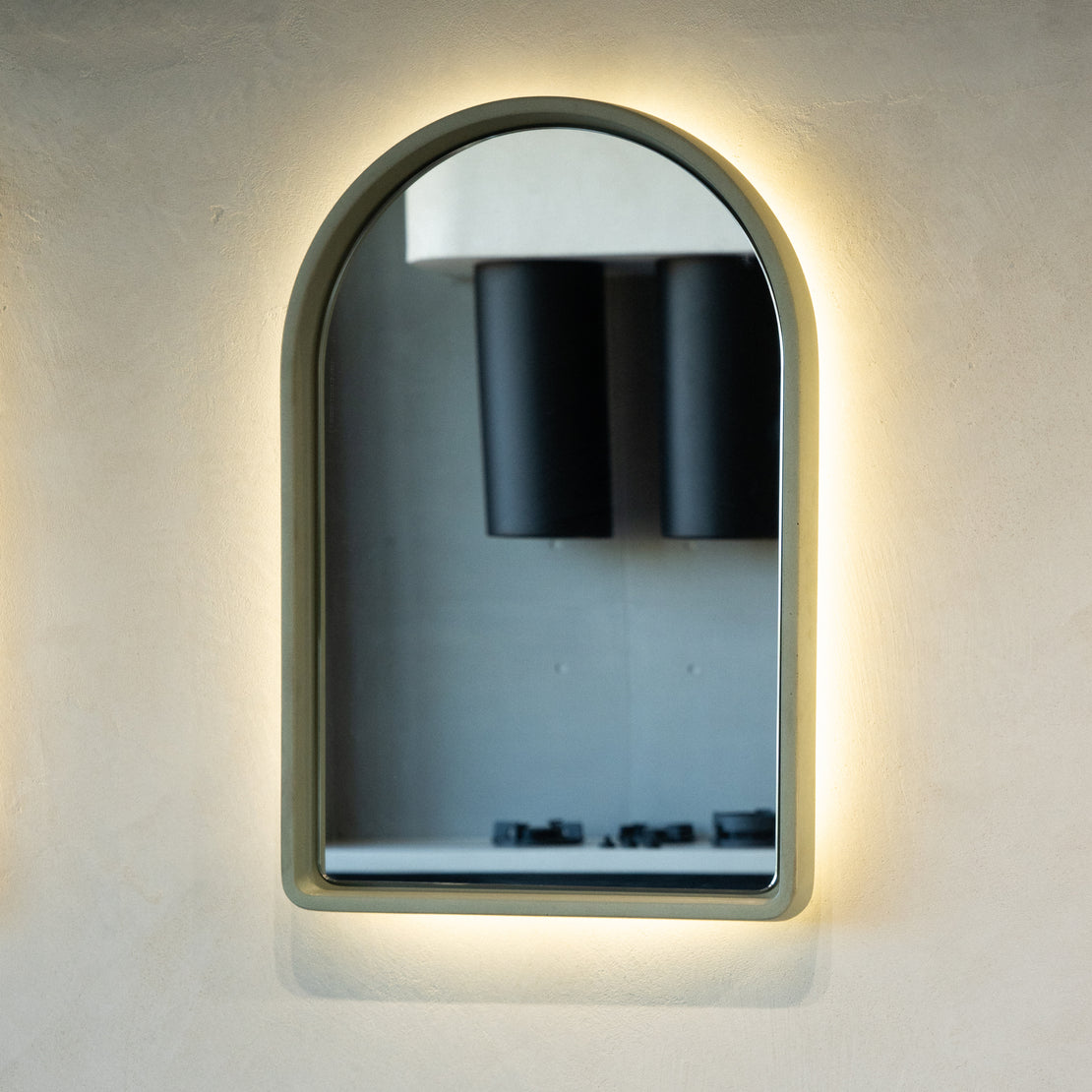 The Arc Concrete Mirror on a blank wall.