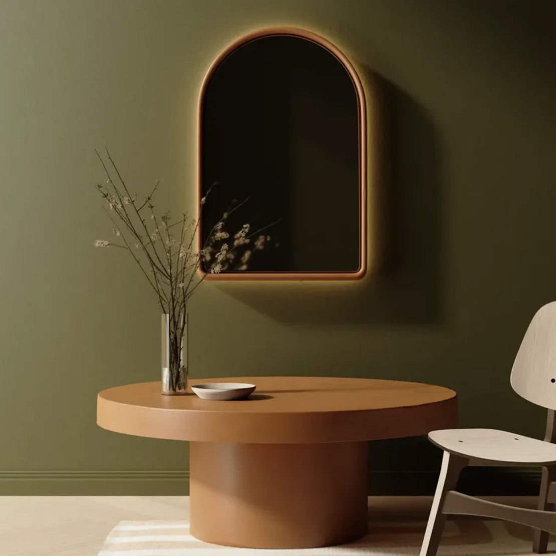 The Arc Concrete Mirror in Dingo above a the Tuscan Concrete Dining Table in a dining room