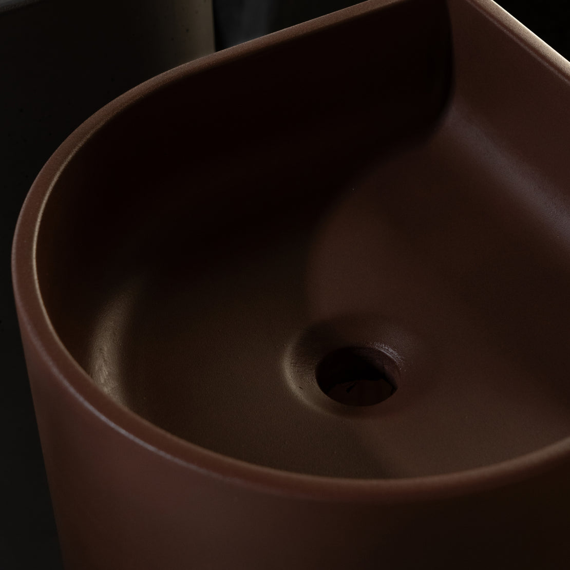 Close up image of a rich merlot coloured concrete basin