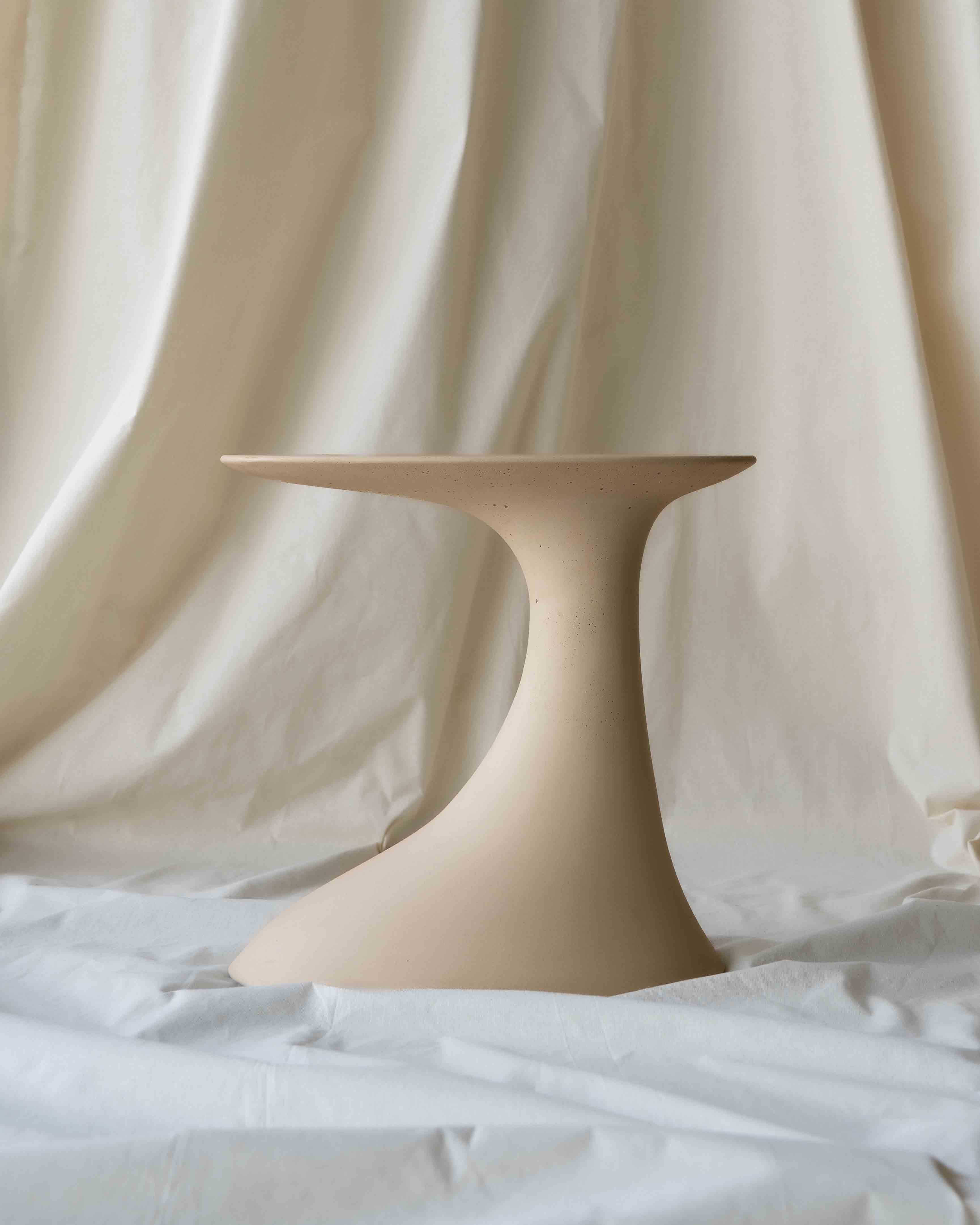 The Oasis Concrete Side Table in the warm nude tone called Bisque