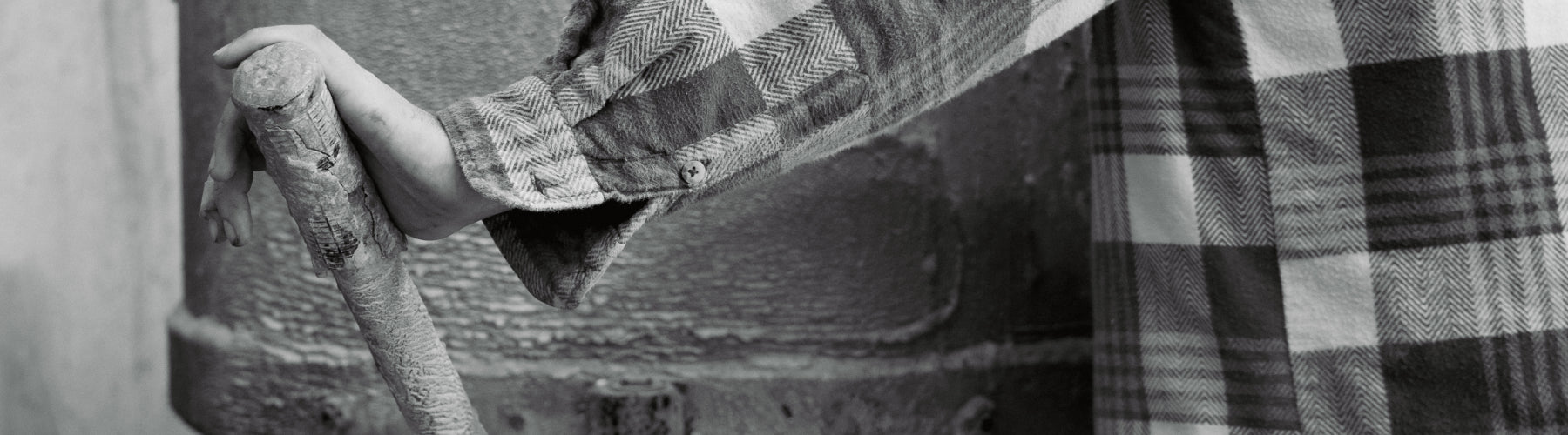 A close up image of a concrete maker using the concrete mixer.