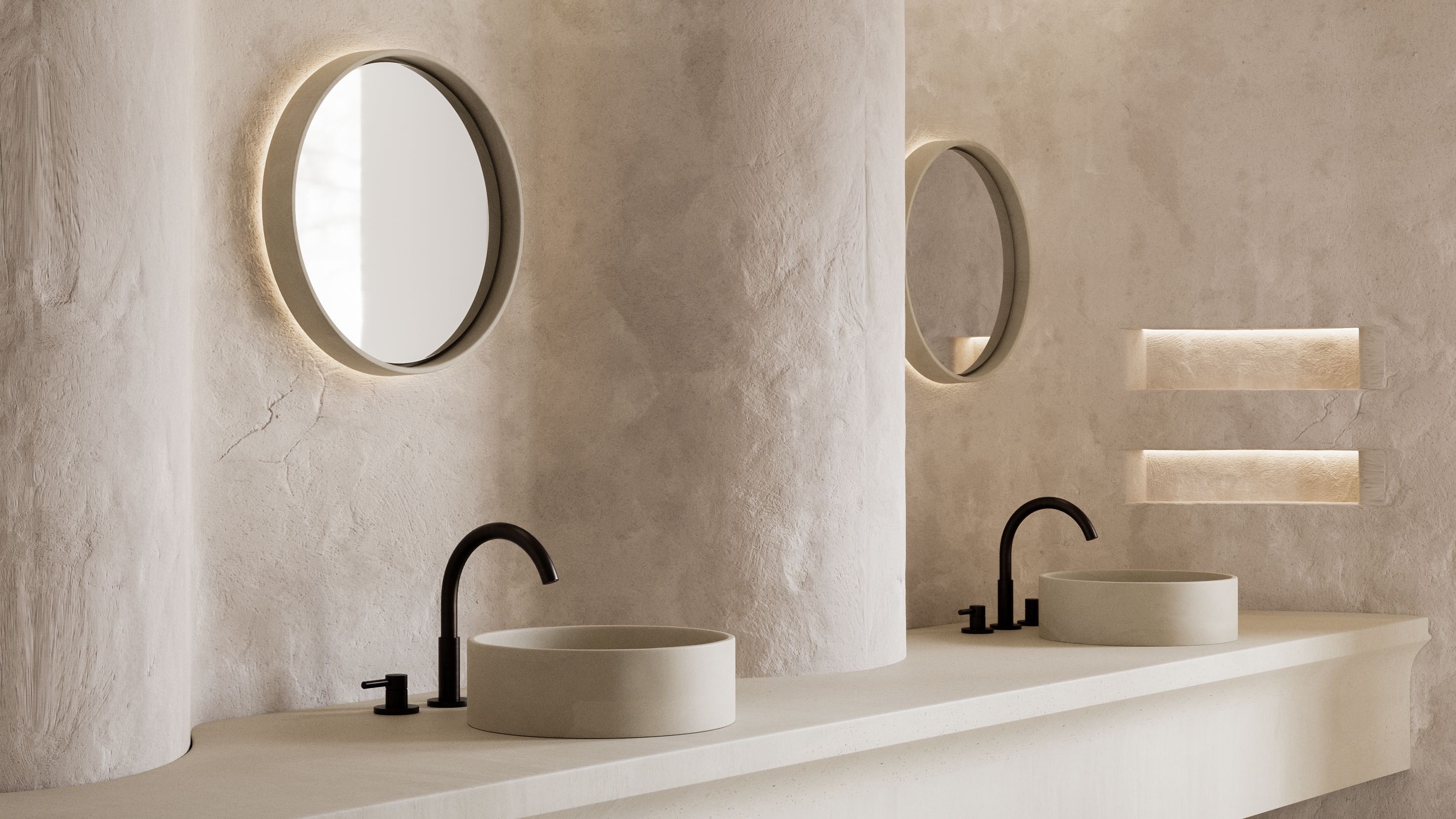 Two Sol Concrete Mirrors fixed to a rendered wall, featuring matching Comet Concrete Basins.