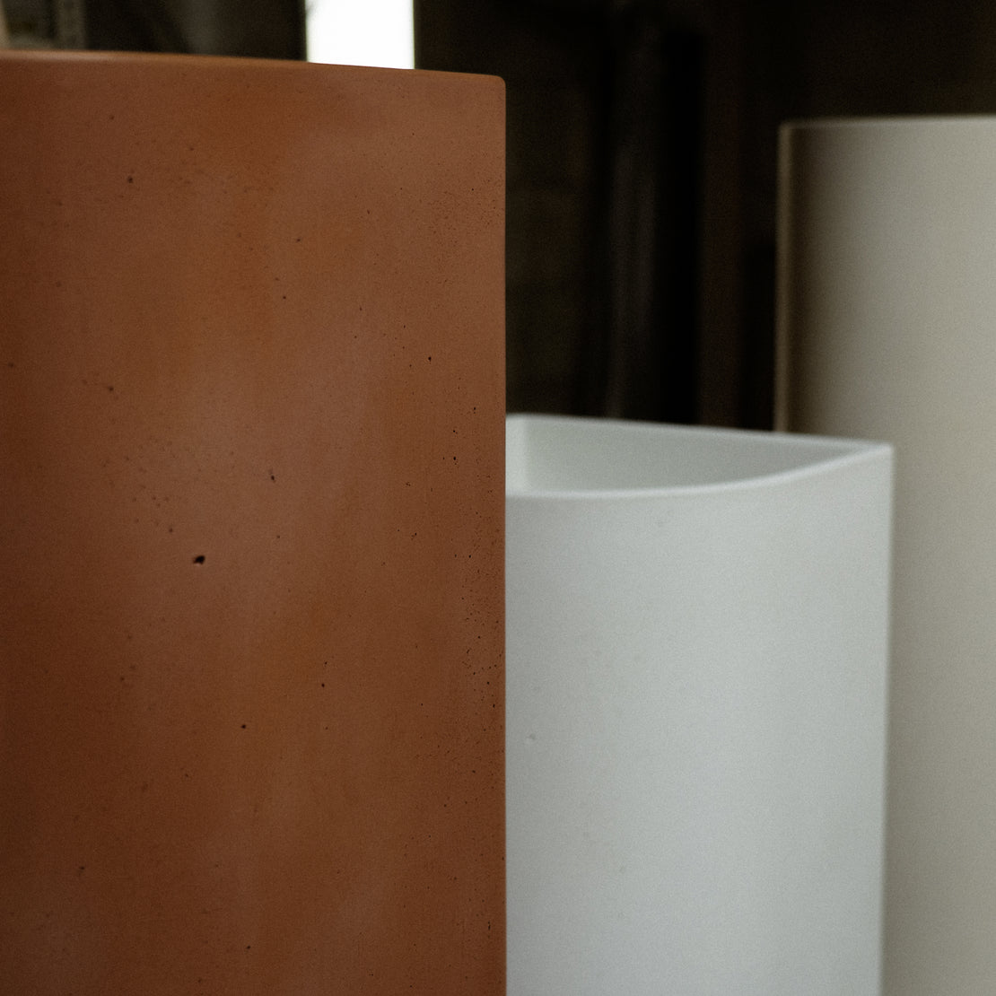 Concrete pedestal basins lined up in the Blend workshop.