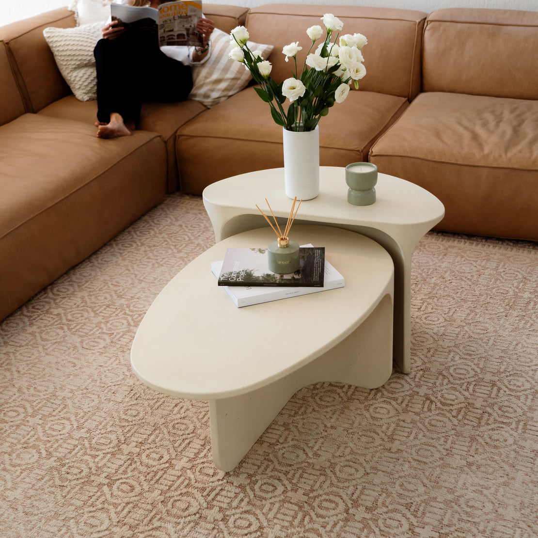 The Riviera Concrete Nesting Set in Sand in a living room