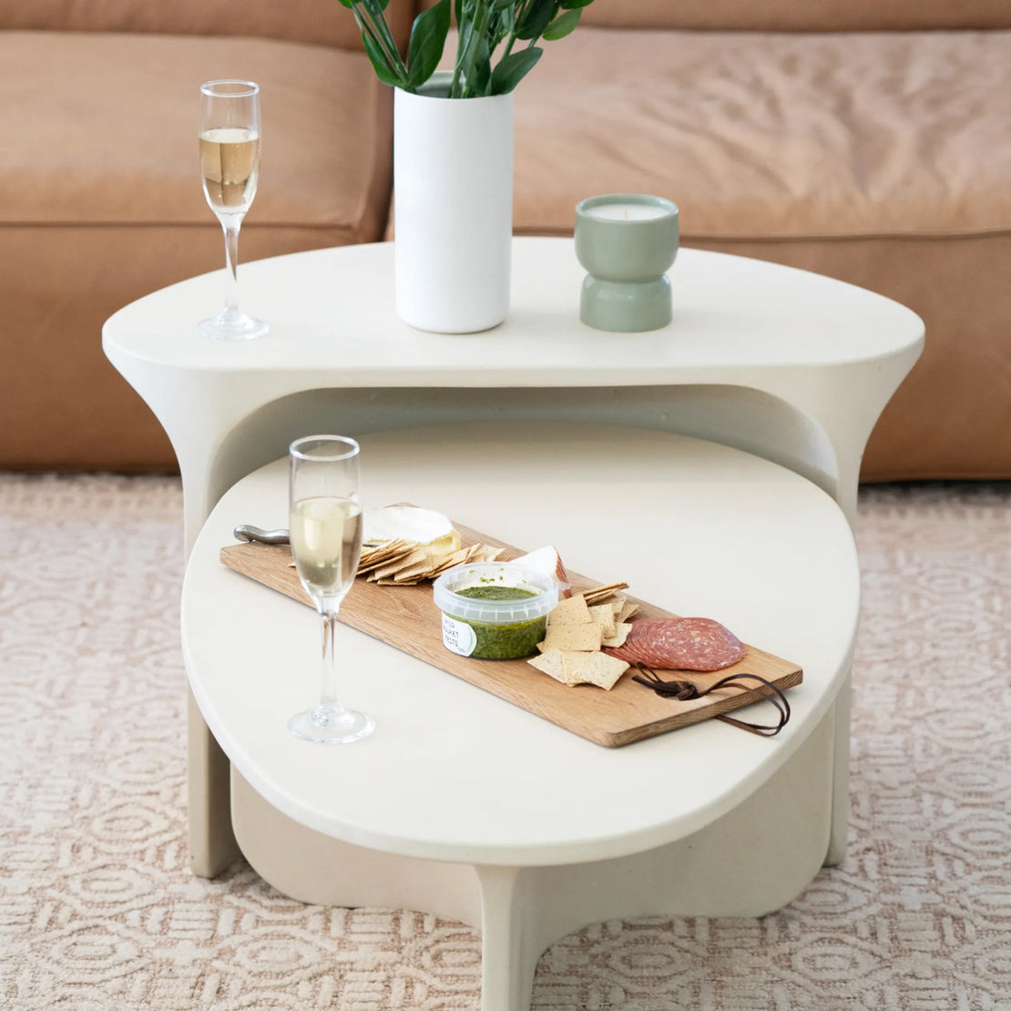 The Riviera Concrete Nesting set in a lounge area with a charcuterie board and candle sitting on top.