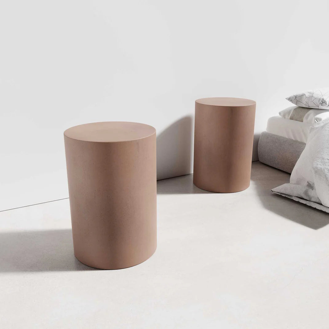 Two Dune Concrete Side Tables in the concrete colour Dingo, featuring minimalist cylindrical designs.