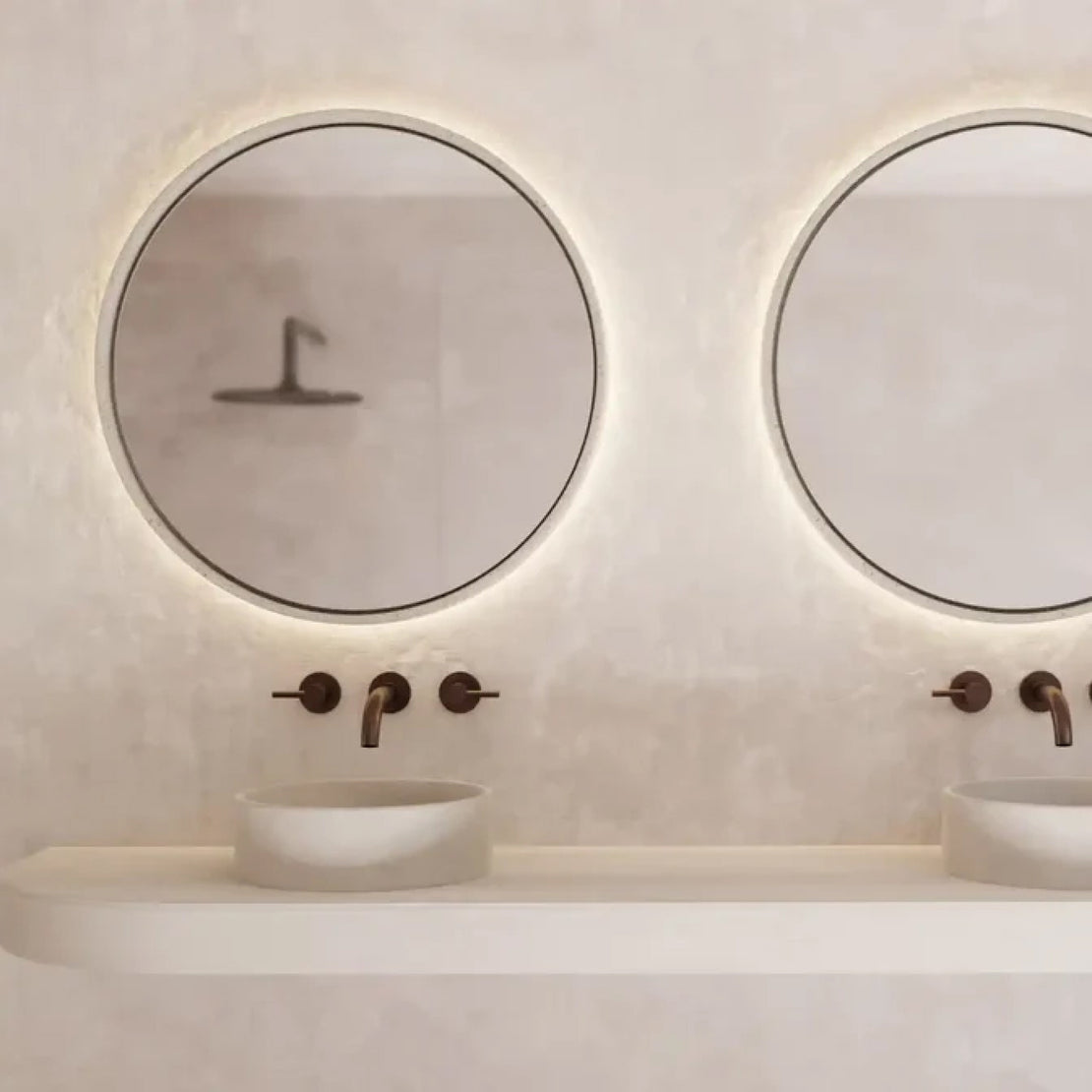 Two Sol Concrete Mirrors and Comet Concrete Basins in a white coloured bathroom.