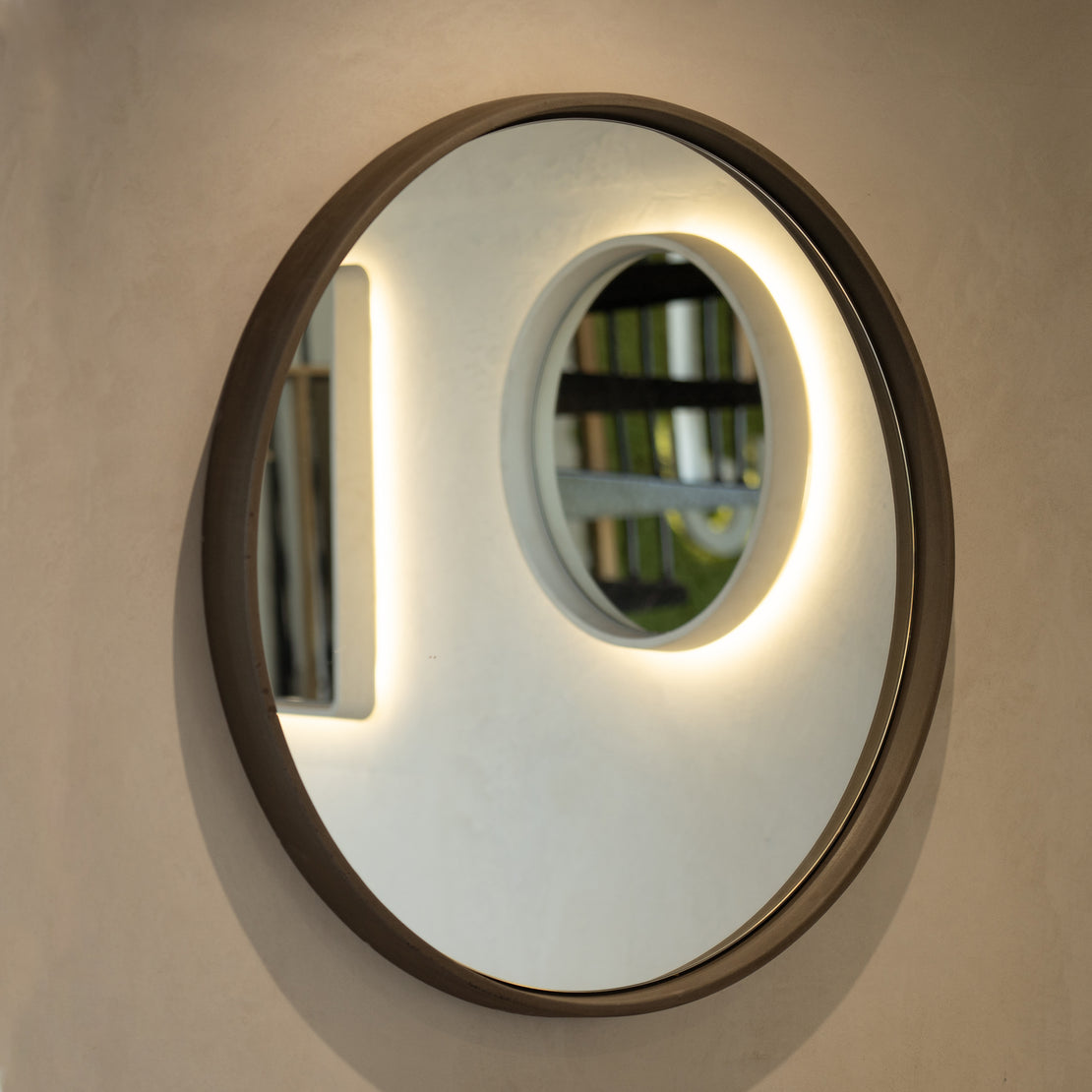 The Sol Concrete Mirror on a blank wall.