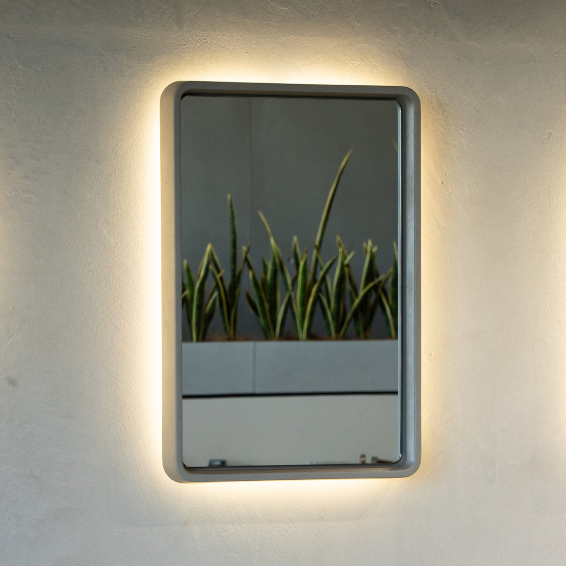 The Stellar Concrete Mirror on a blank wall.