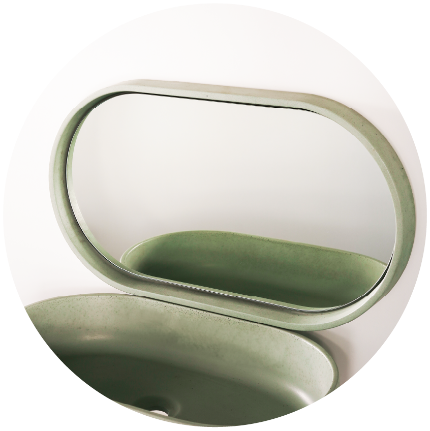 A matching set of the pill shaped Eclipse Concrete Basin and Lunar Concrete Mirror in the concrete colour Rainforest Green. 