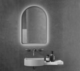 Arc Concrete LED Mirror in a black and white bathroom.