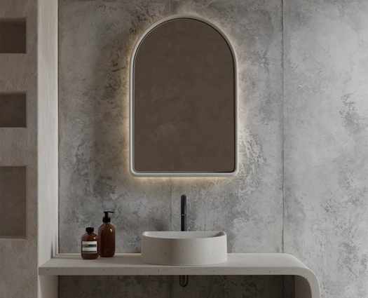 A combination of the Crescent Concrete Basin and the large Arc Concrete mirror in the colour whitehaven in a sleek industrial style bathroom.