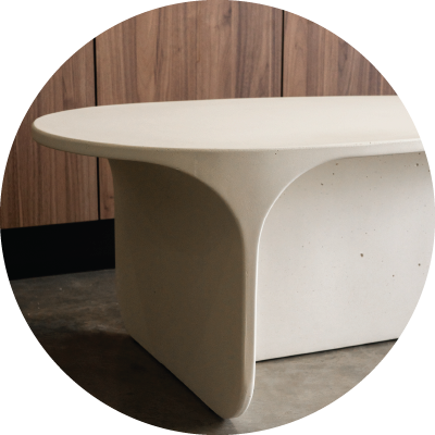 The curved end of the Riviera Concrete Coffee Table in the colour whitehaven.