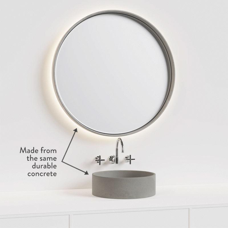 A round Sol LED Concrete Mirror with matching round Comet Concrete Basin rotating through the different concrete colours.