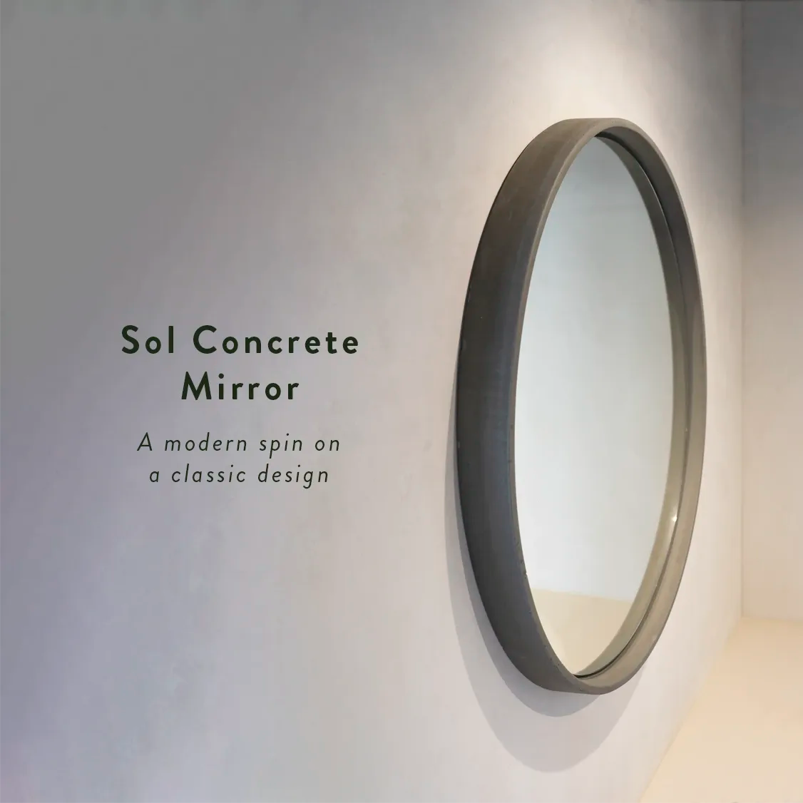A cream microcement rendered wall with a Large Sol Concrete Mirror with the text 'The Sol Concrete Mirror. A modern spin on a classic design.'